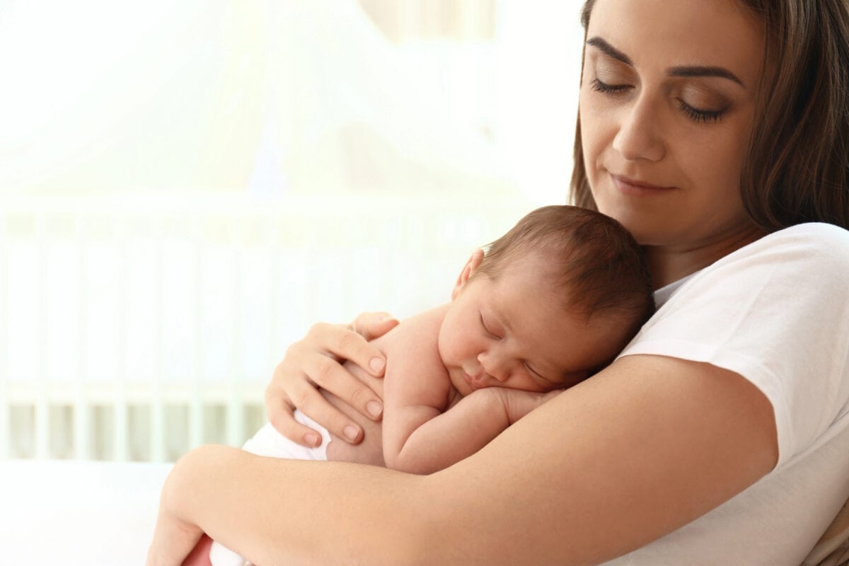 mom holding newborn baby