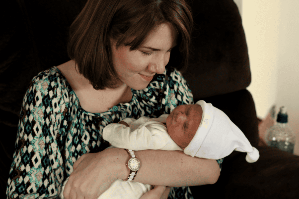 new mom holding newborn baby