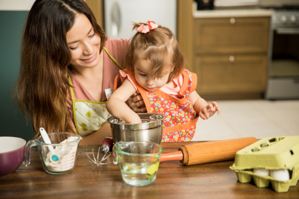 mom cooking with toddler