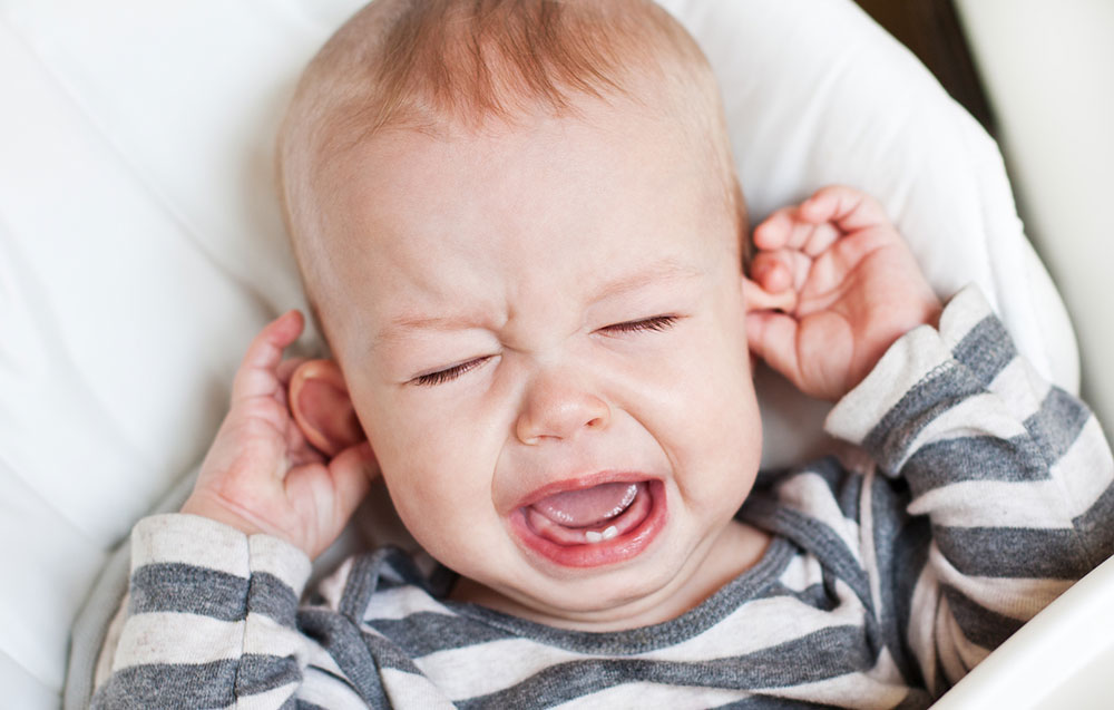 crying teething baby