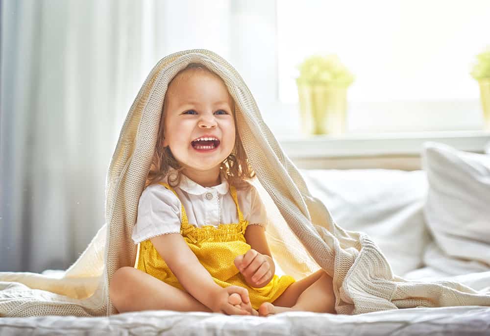 happy toddler keeps getting out of bed