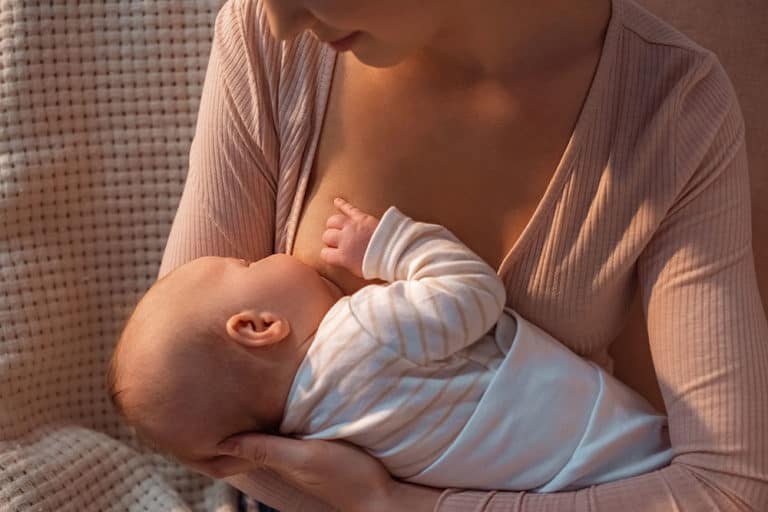 mom giving her baby a dream feed