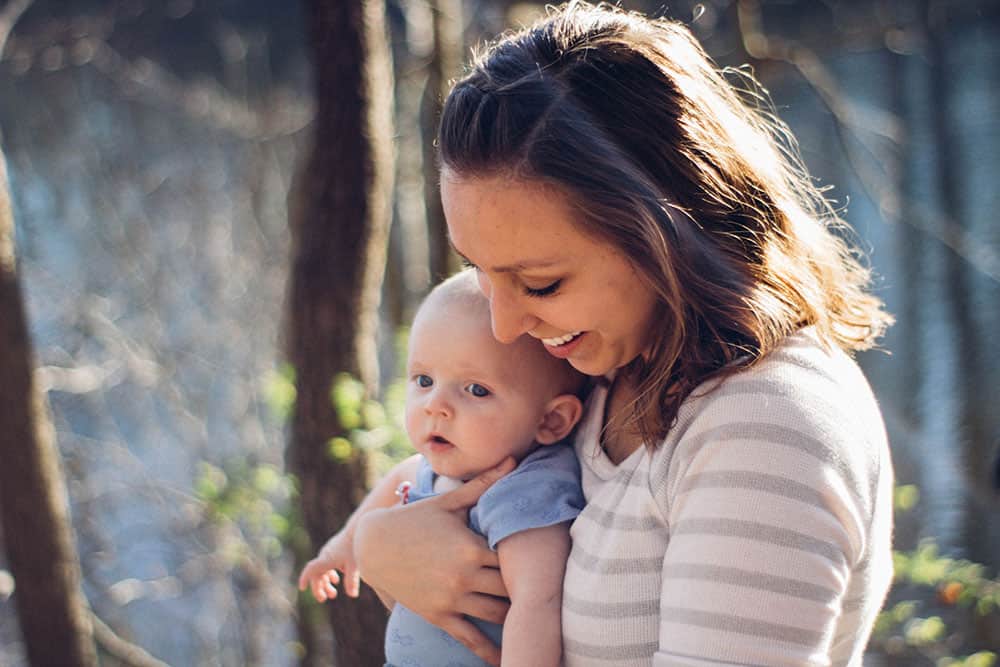 mom holding baby