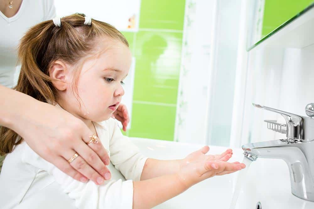 toddler washing hands