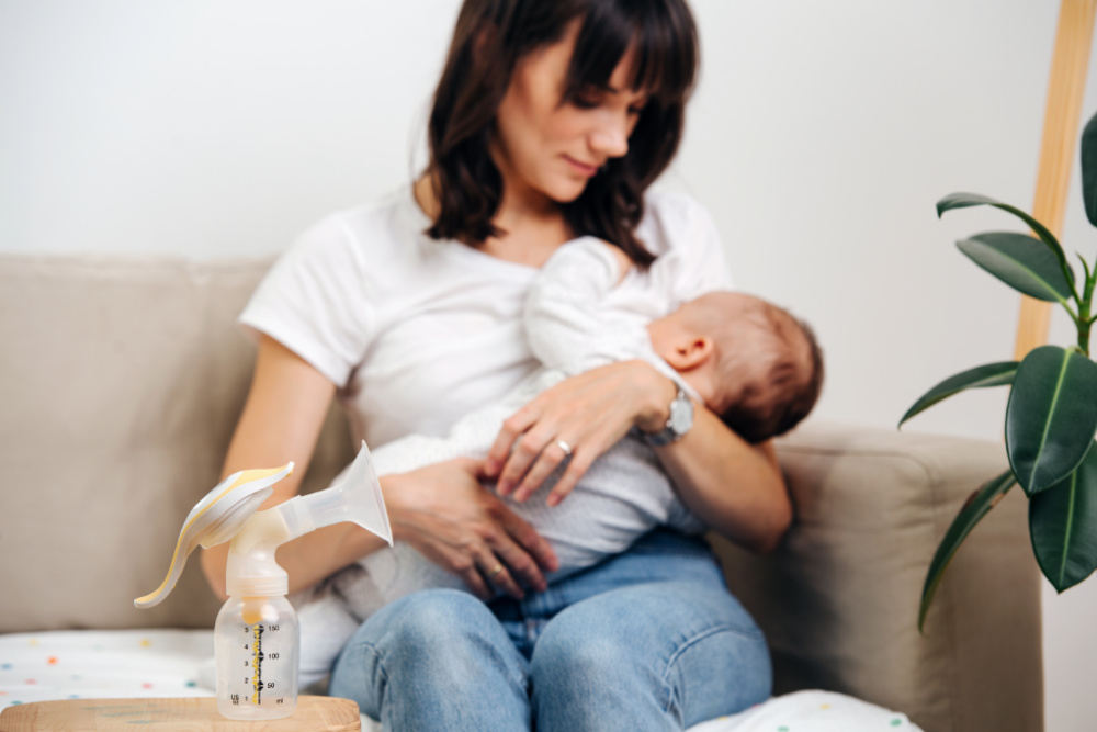 how to survive the first month with a newborn mom holding baby