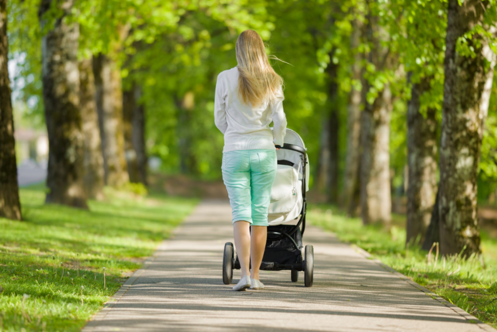 mom walking baby in stroller