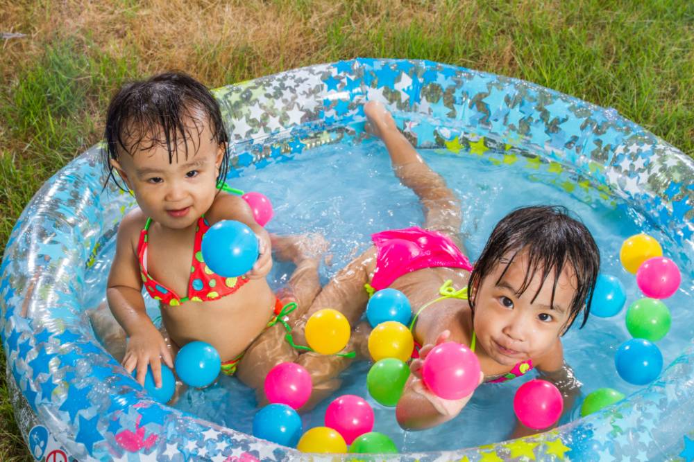 toddlers in a paddle pool