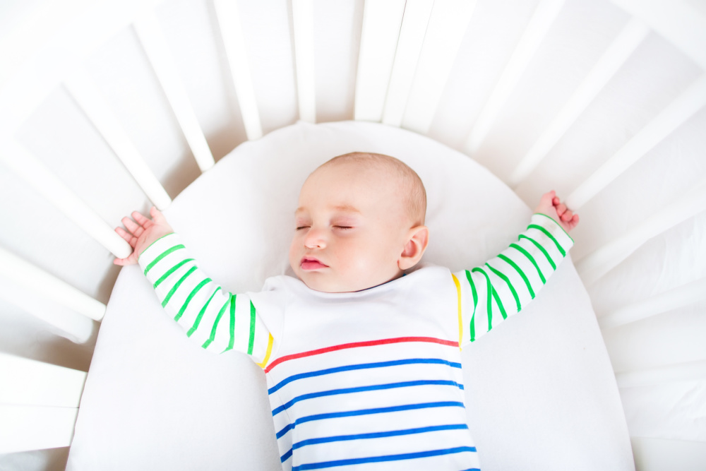 baby asleep in crib