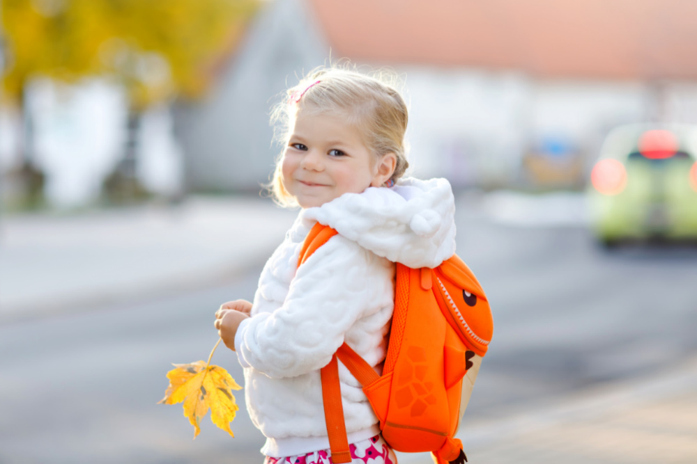toddler wearing backpack