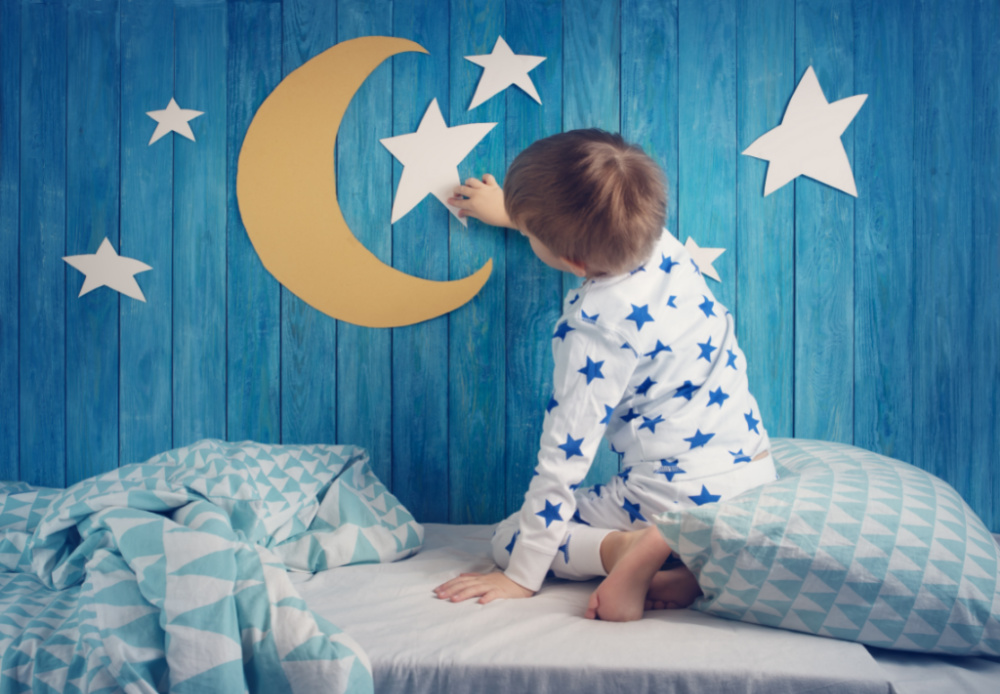 toddler pointing to wall art