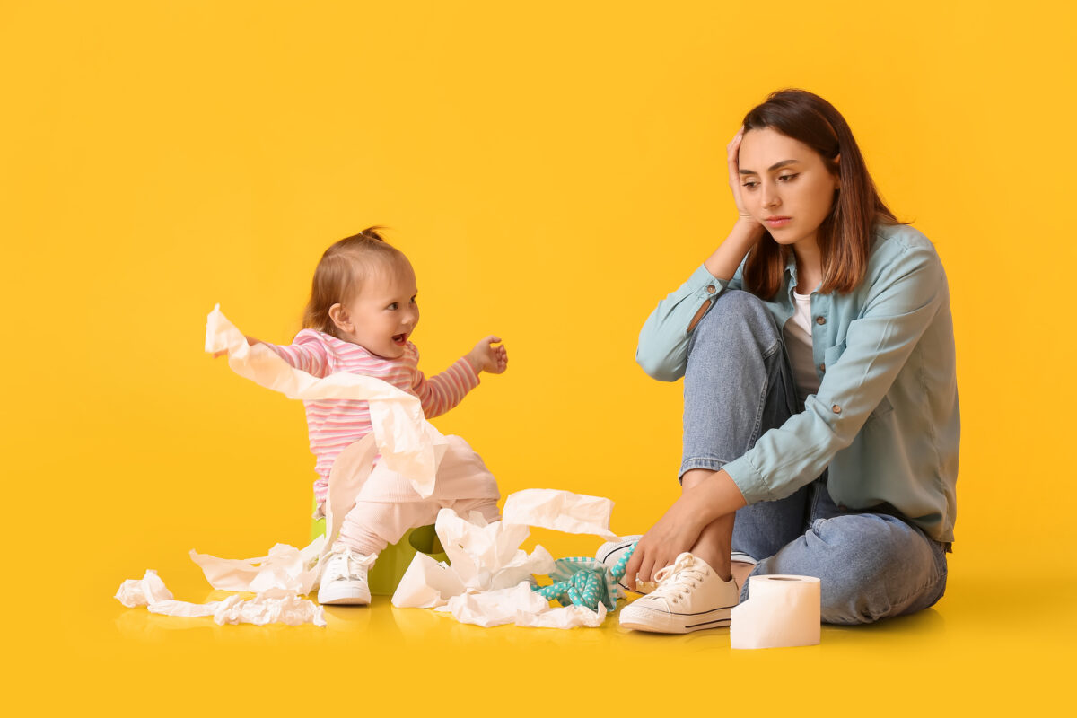 tired mom trying to potty train toddler