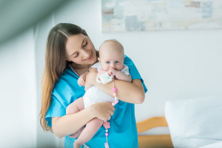 new mom holding newborn baby