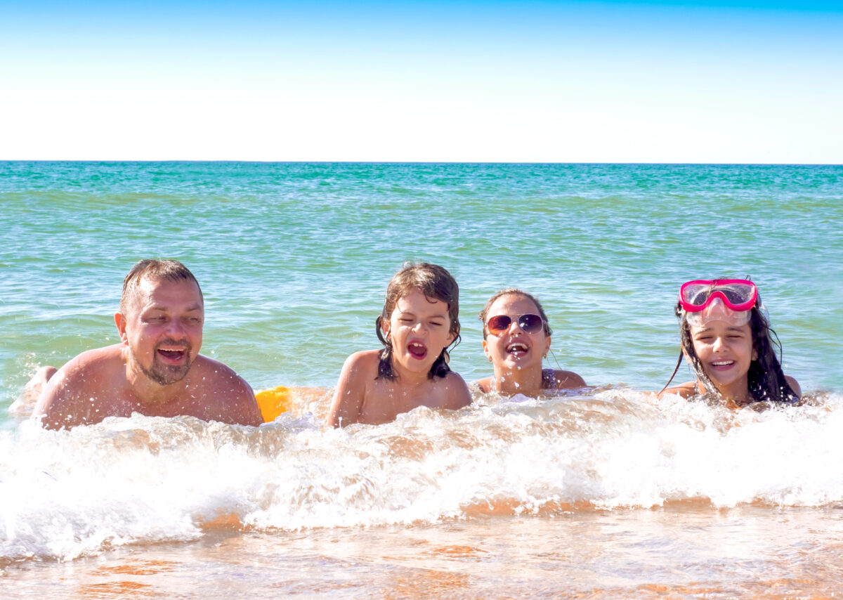 family on vacation at the beach