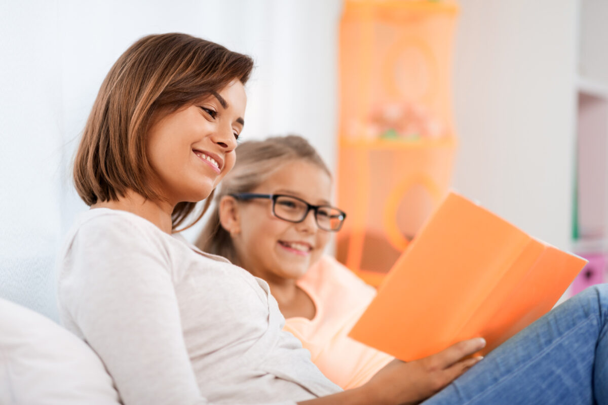 mother reading to daughter