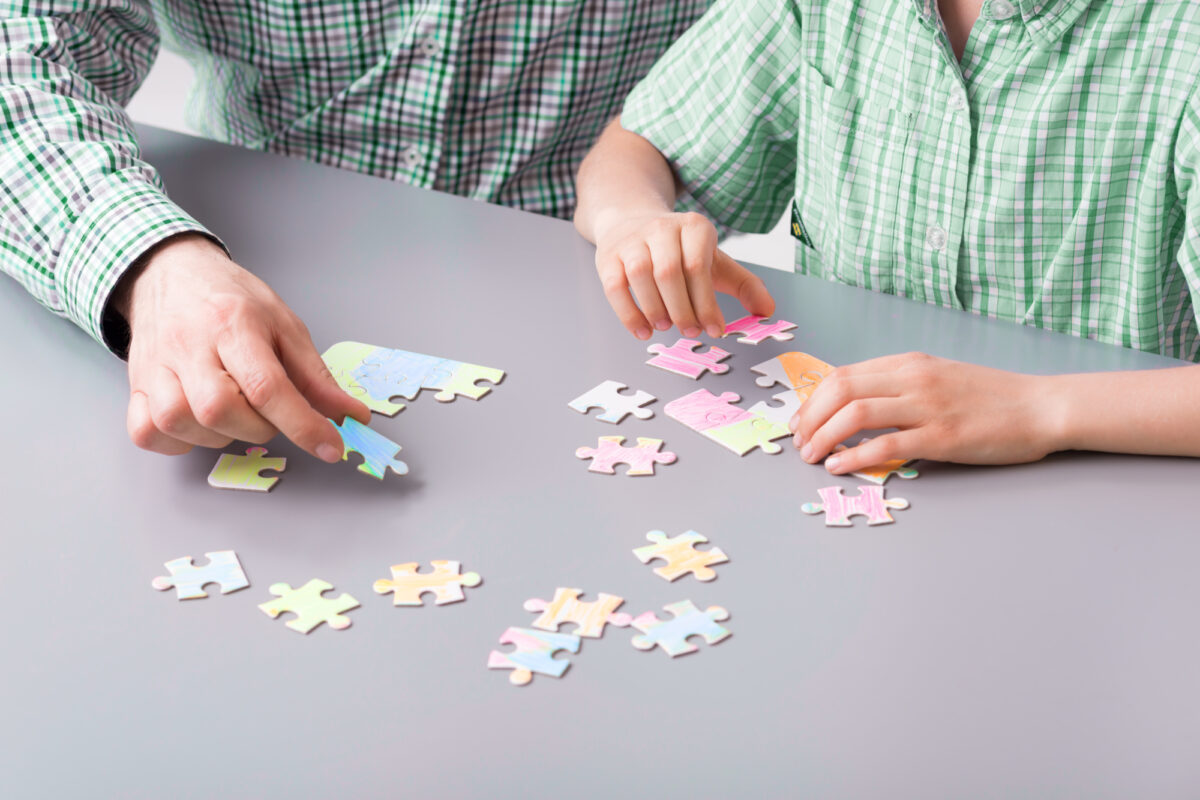 family doing puzzle
