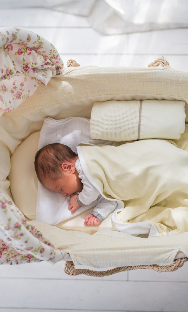 baby asleep in bassinet