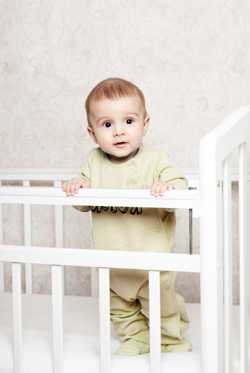 baby standing in crib