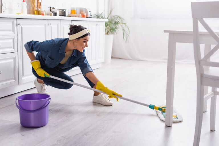 woman showing how to clean a house in one day