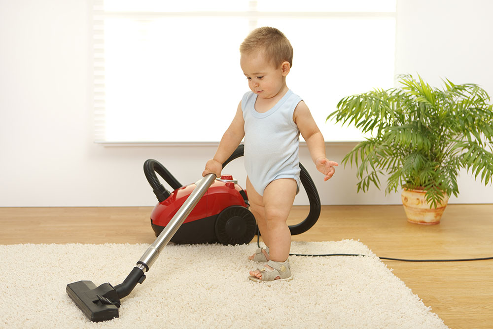 little kid cleaning floors