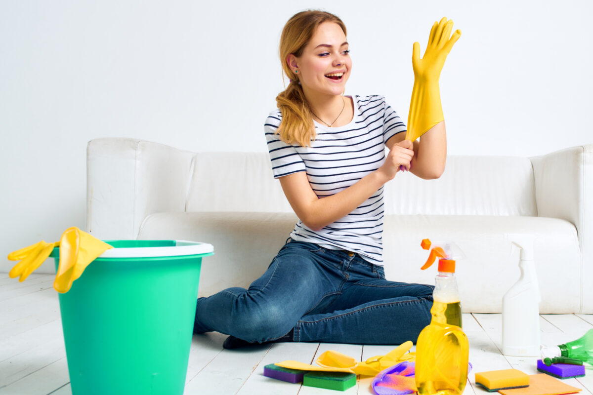 woman ready to clean discolored vinyl flooring