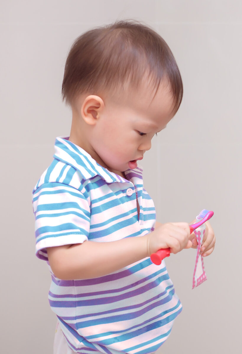 little boy brushing teeth