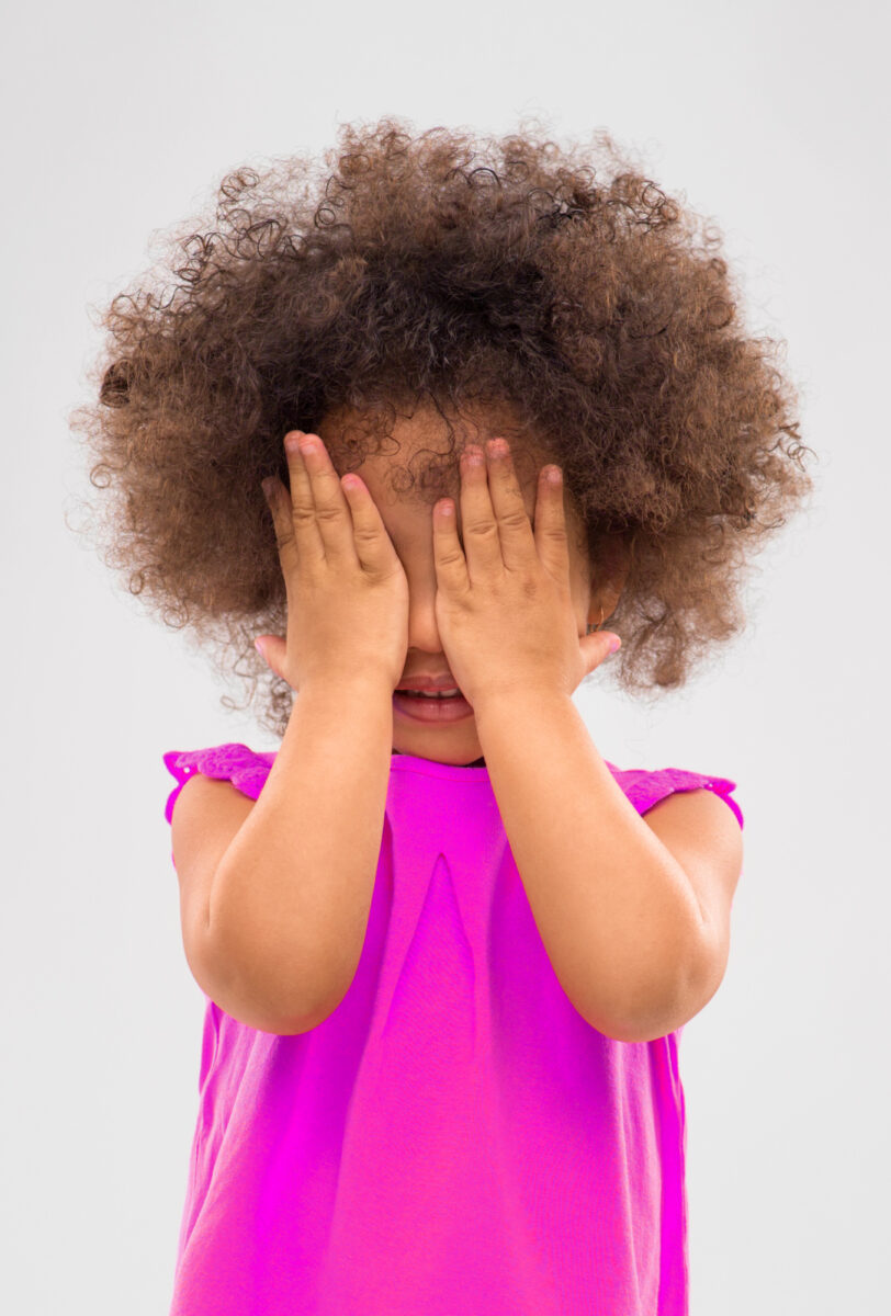 toddler playing hide n seek