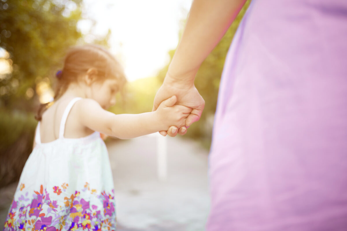 parent walking with toddler