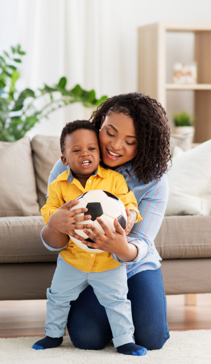 toddler playing with a ball