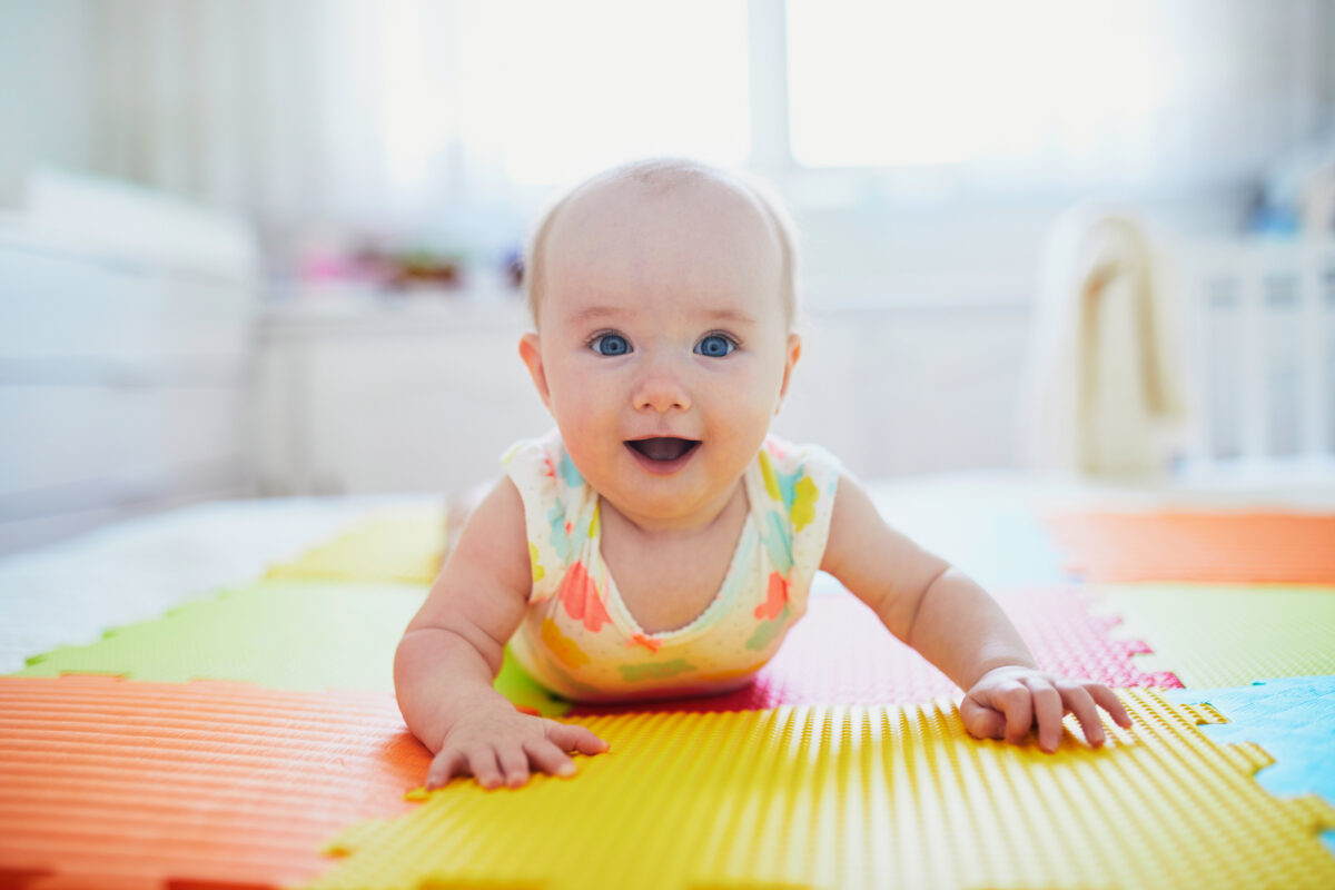 6 month old baby doing tummy time