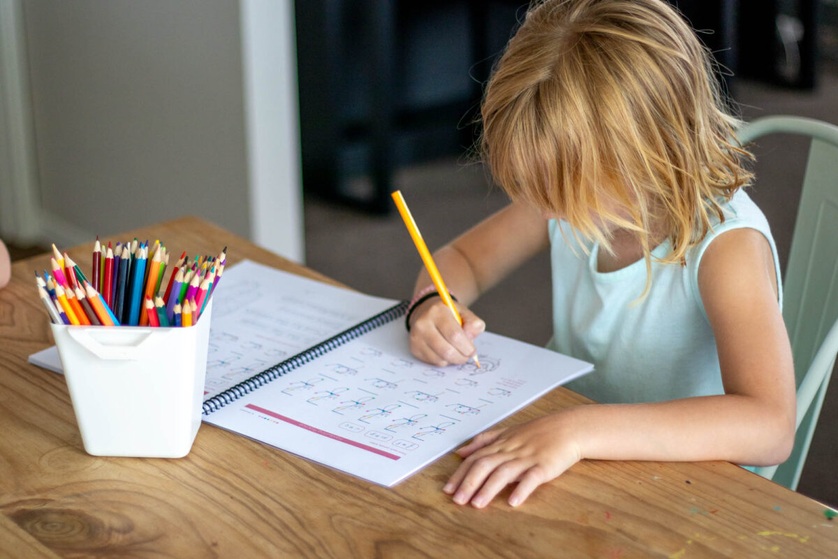 little girl doing homeschool handwriting