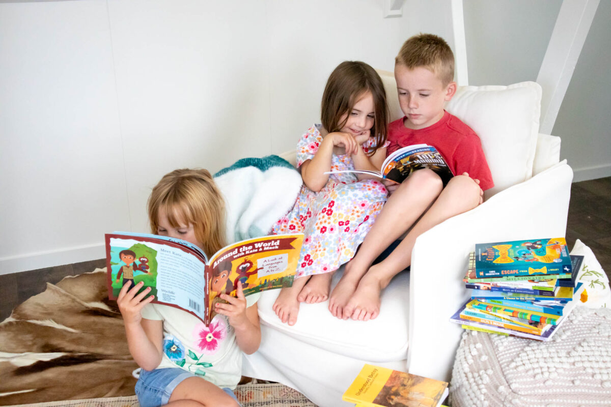 siblings reading together