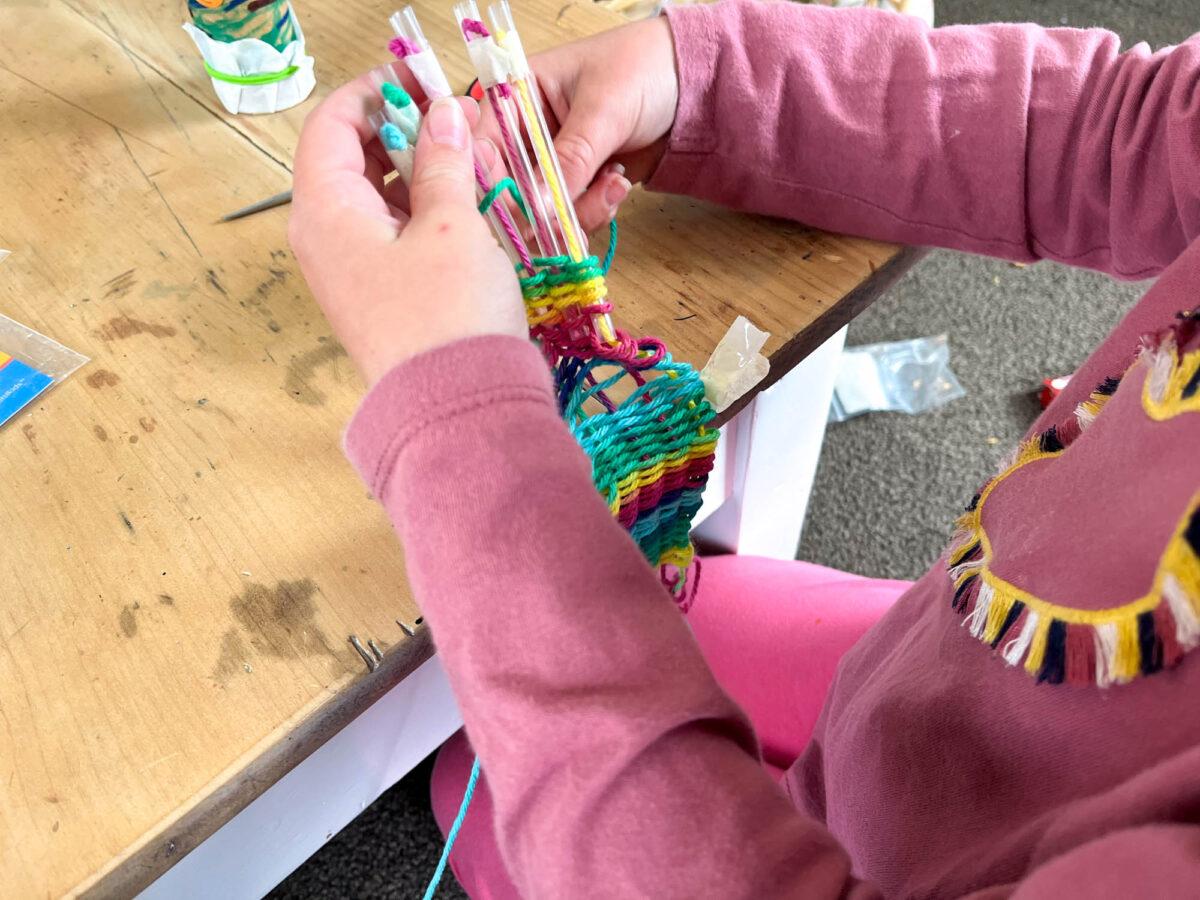 little girl weaving