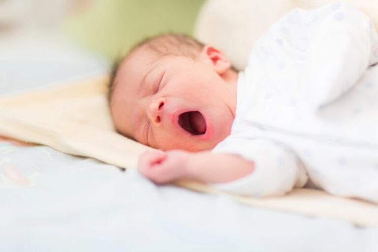 newborn baby yawning before baby bedtime routine