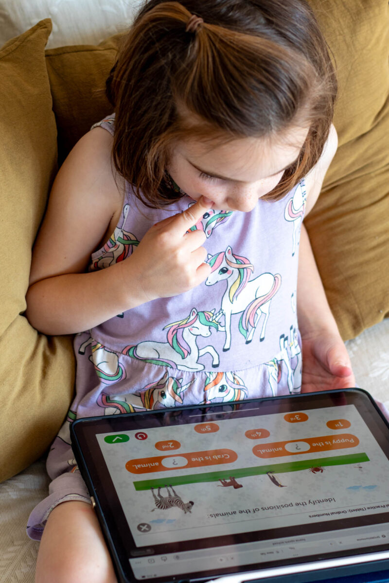 Young girl using math app