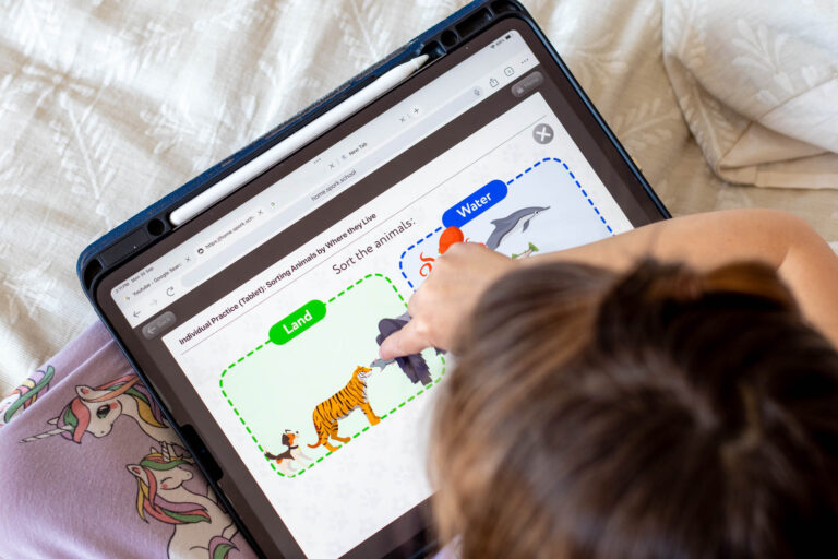 little girl using SPORK Education's kindergarten math curriculum