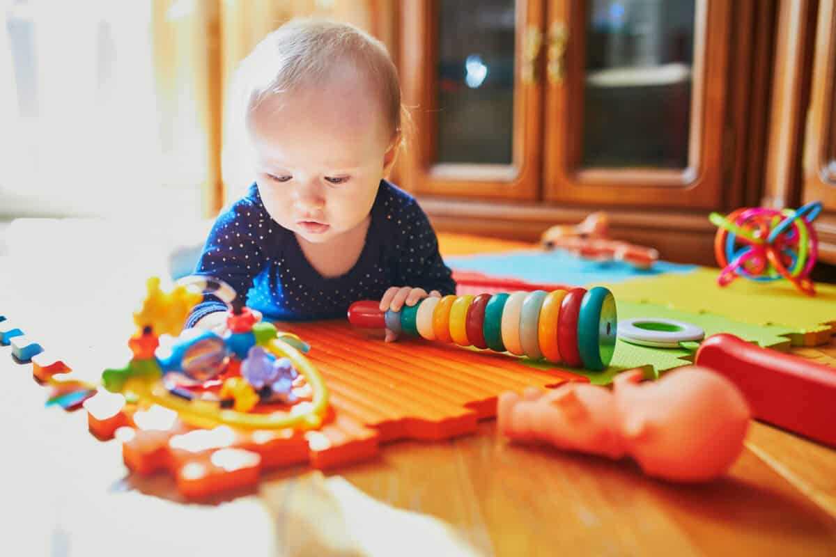 baby playing with toys on the floor