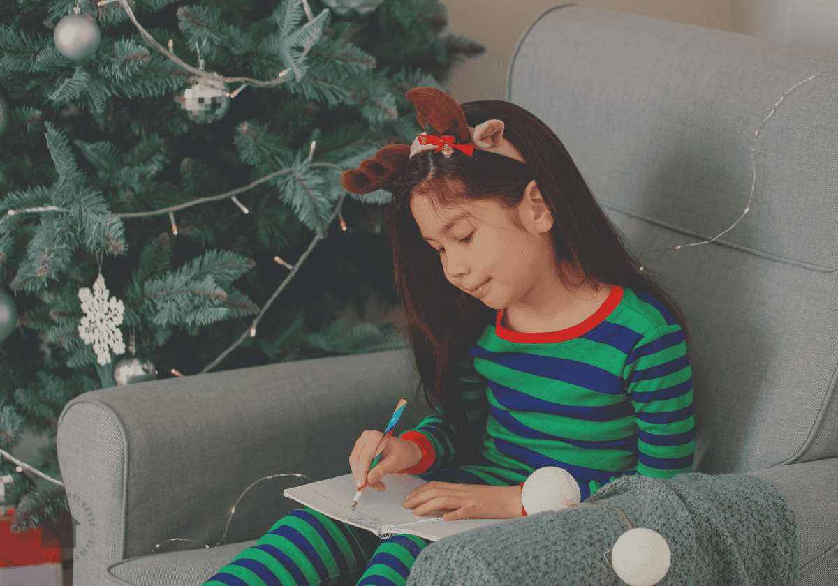 child doing christmas writing