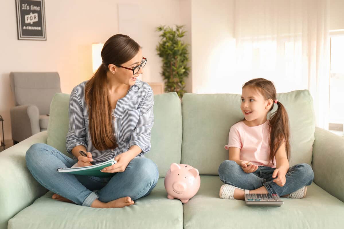mom teaching daughter real life skills about budgeting