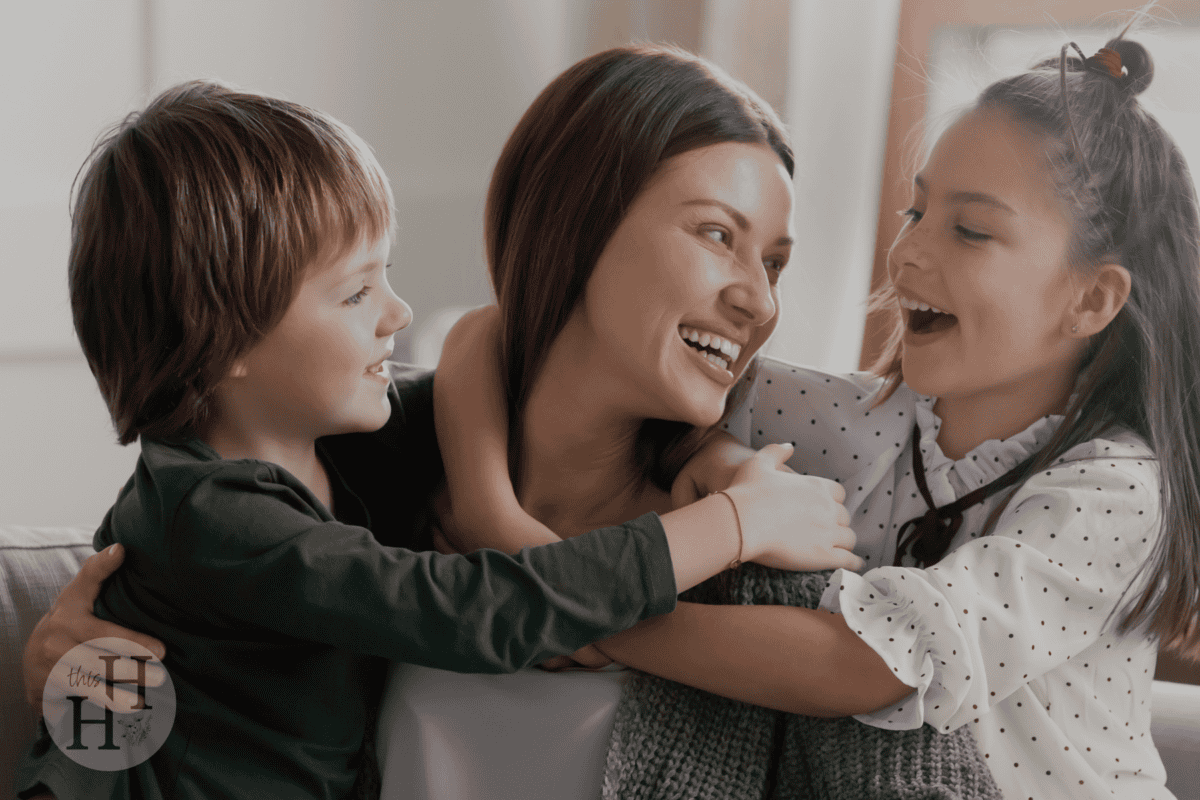 mom hugging children