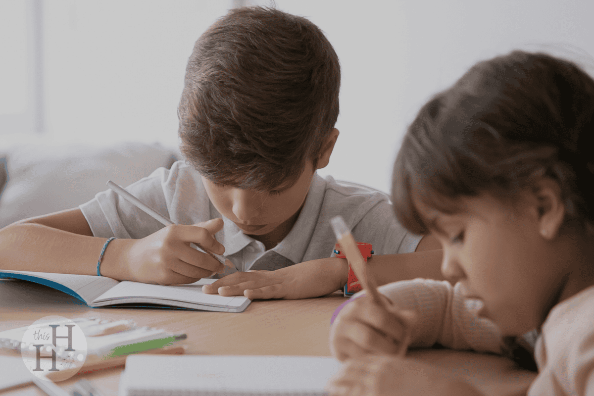 siblings doing their homeschool work without sibling rivalry