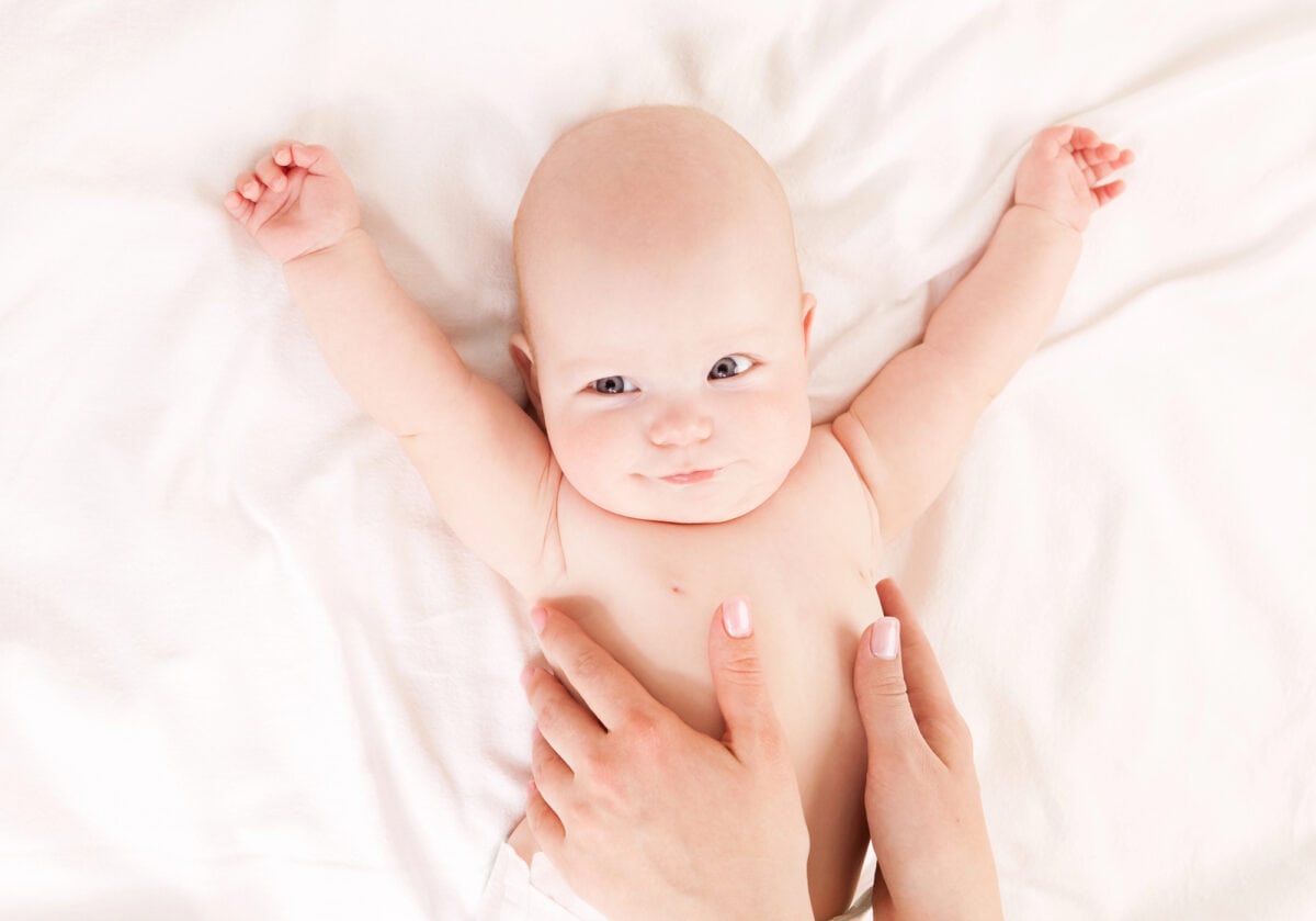 three week old newborn stretching