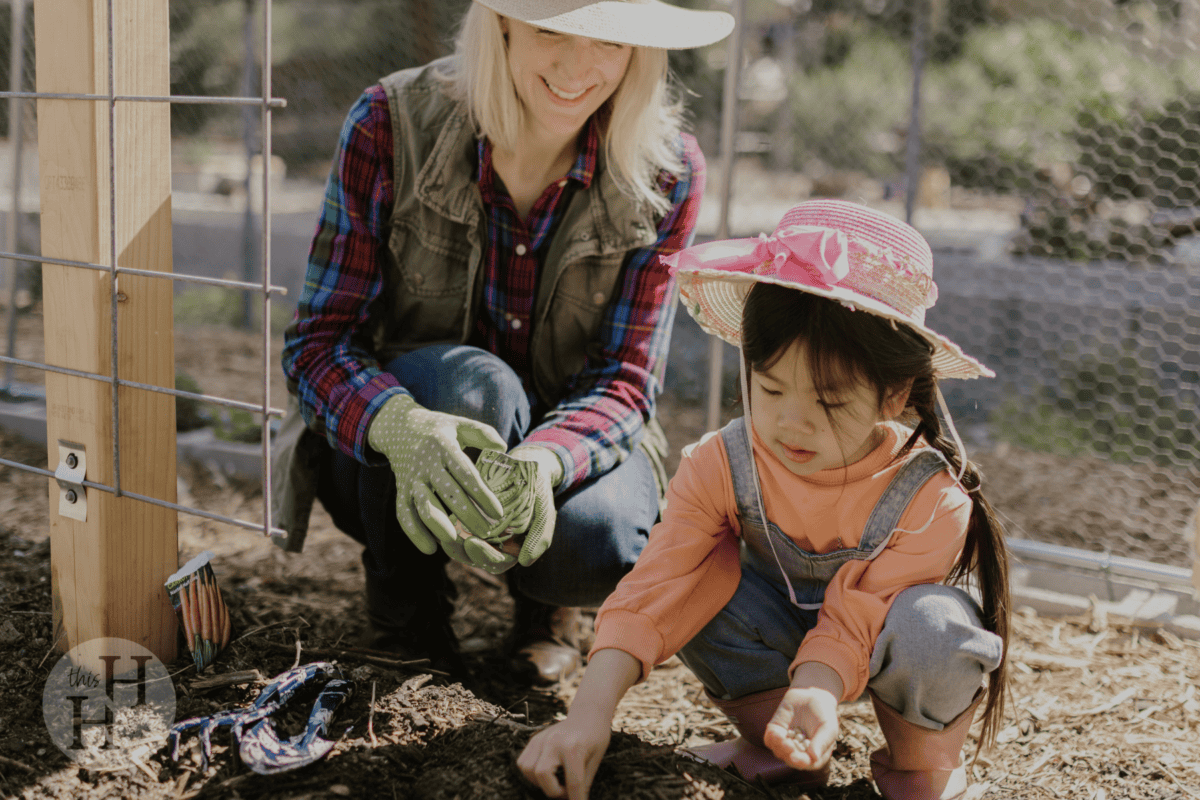 child planting seeds