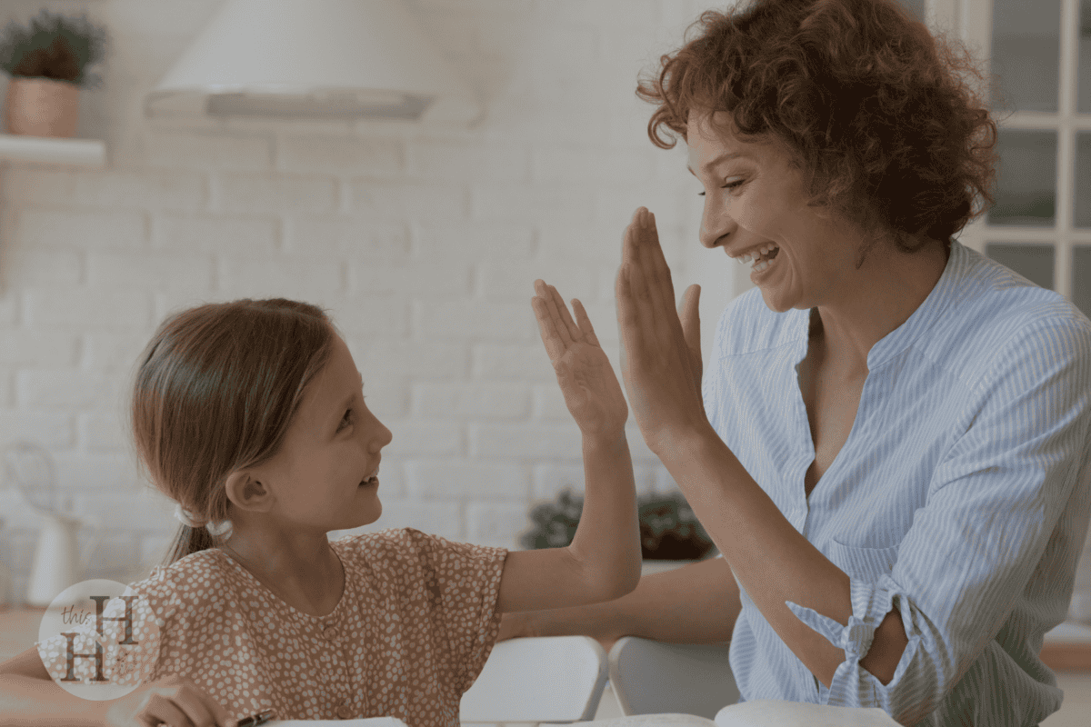 mom high fiving daughter