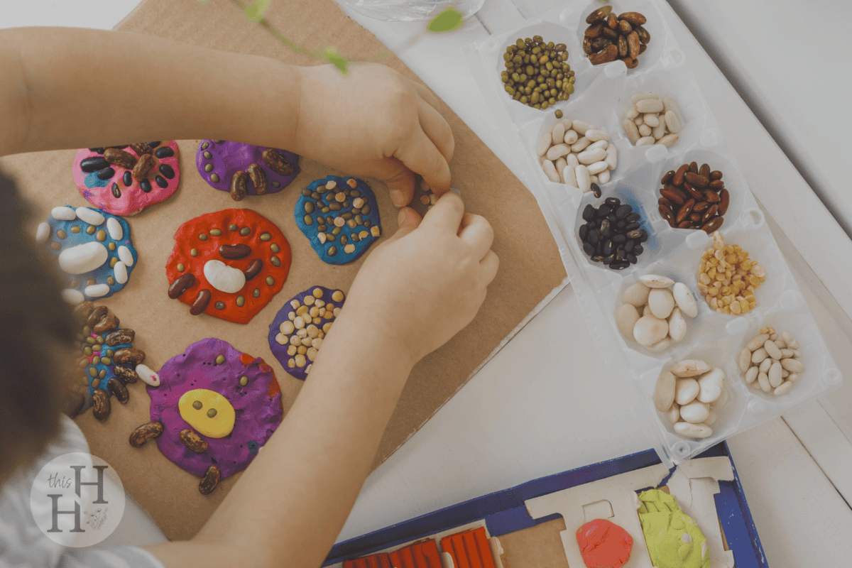 child creating nature collage