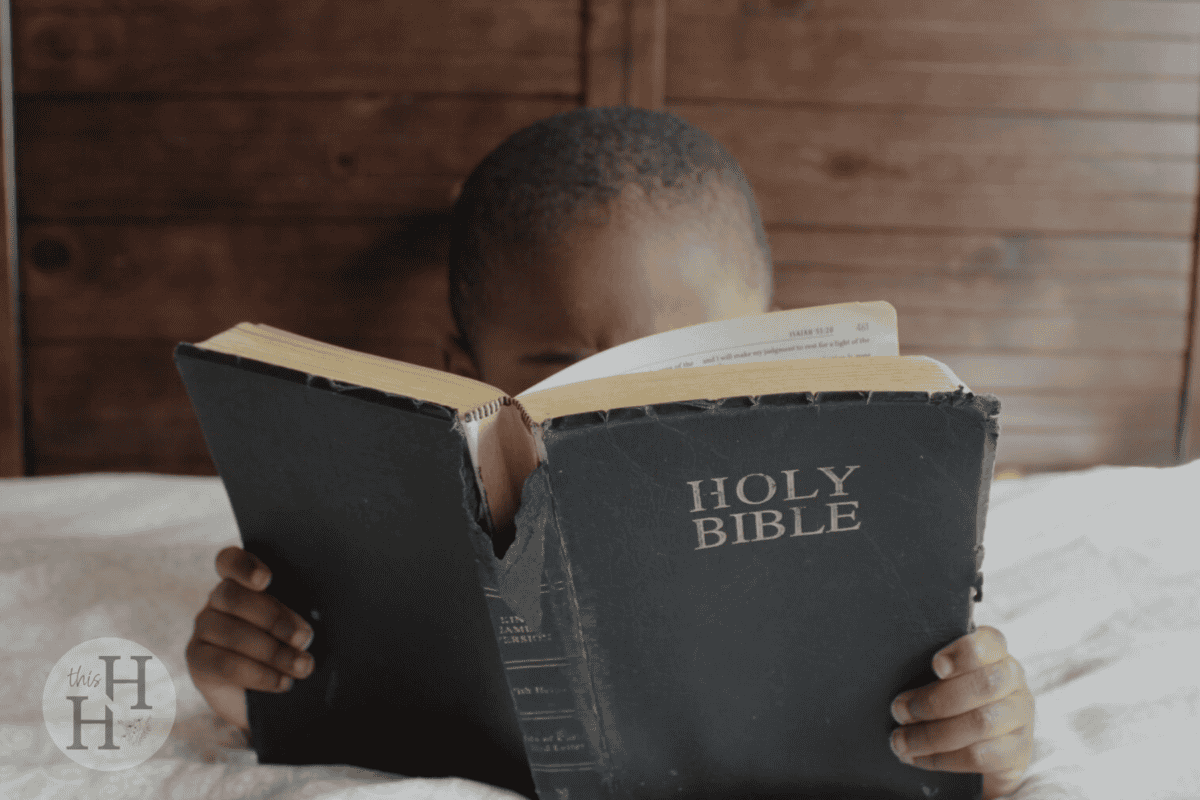 child holding a bible