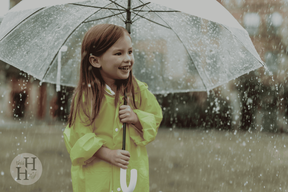 little girl holding an umbrella