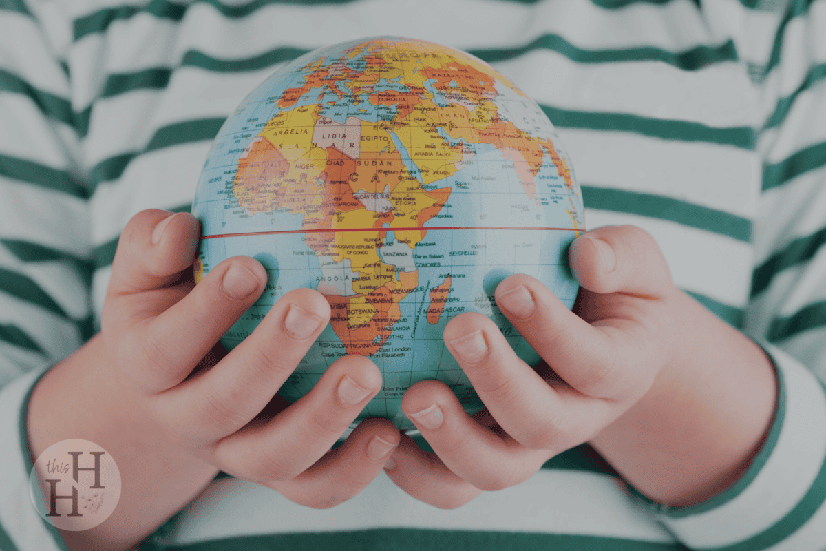 child holding globe