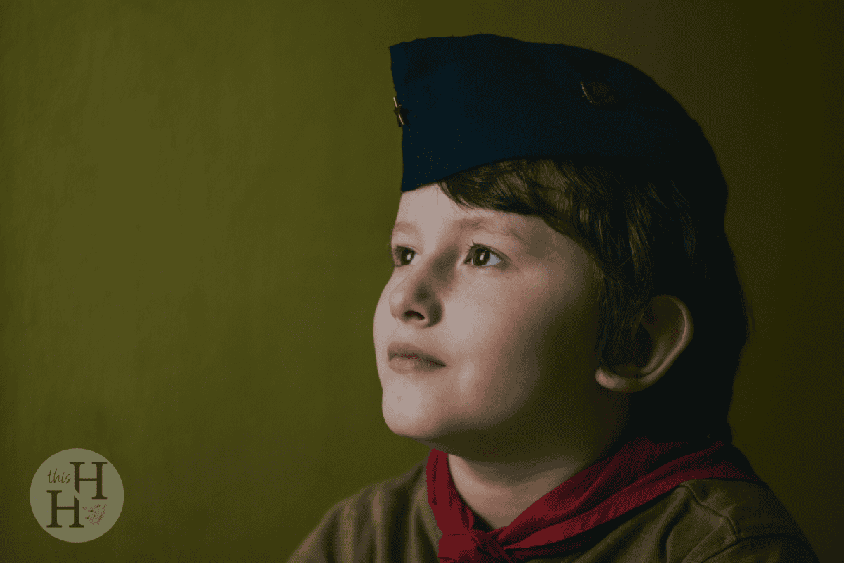 child dressed as scout