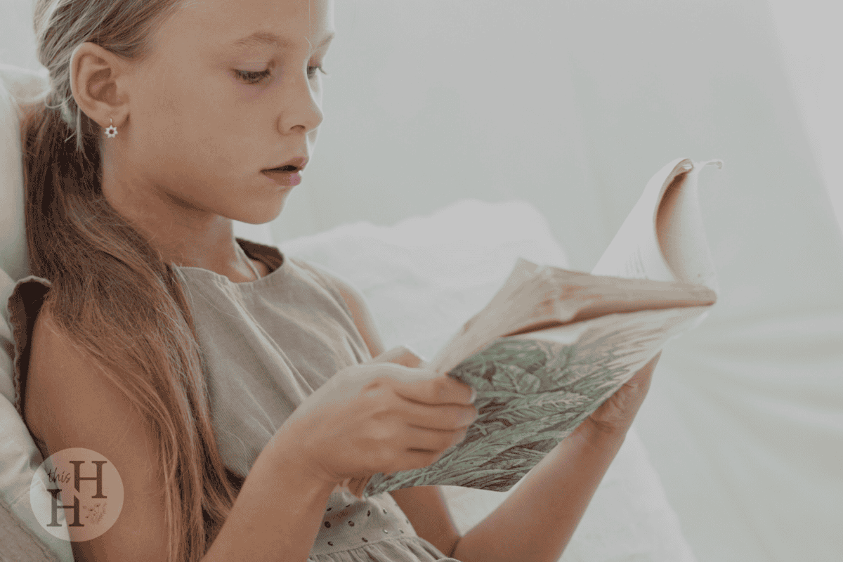 young girl reading book