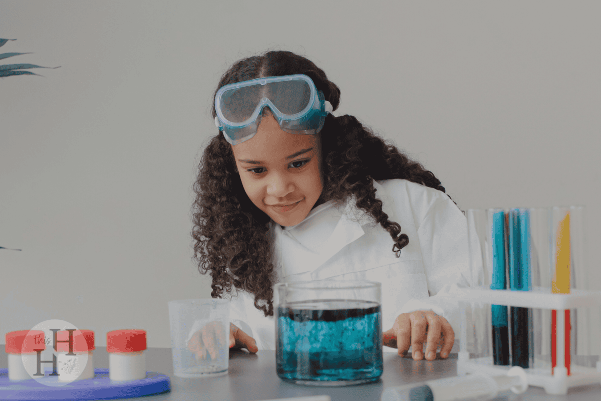 young girl doing science experiment